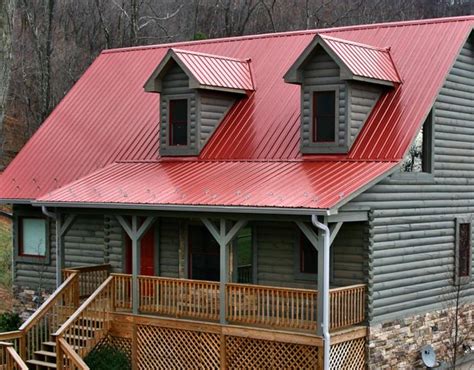 red metal roof on grey house|red and grey house.